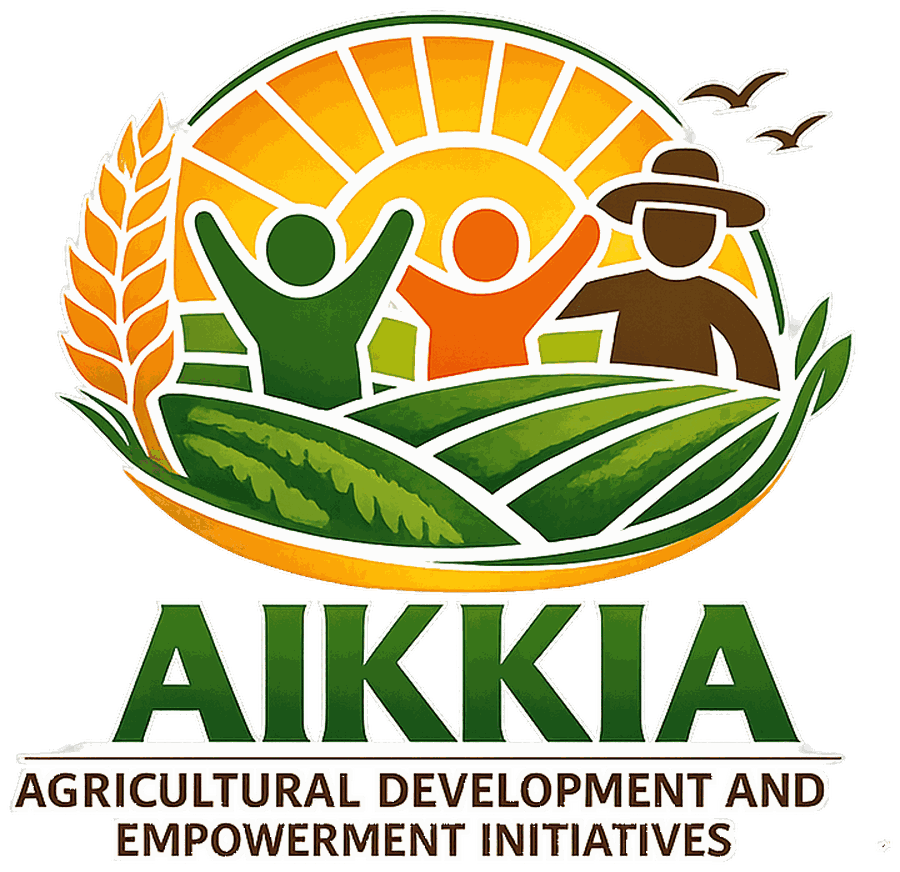 The AIKKIA emblem: a rising sun over green farmland, with a farmer, a woman and a young person raising their arms, framed by wheat and leaves.
